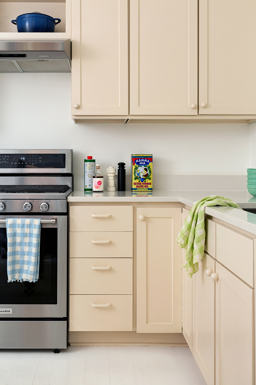 warm white cabinets with matching knobs