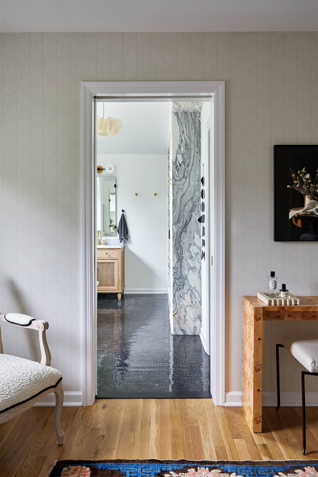 view from primary bedroom into bathroom