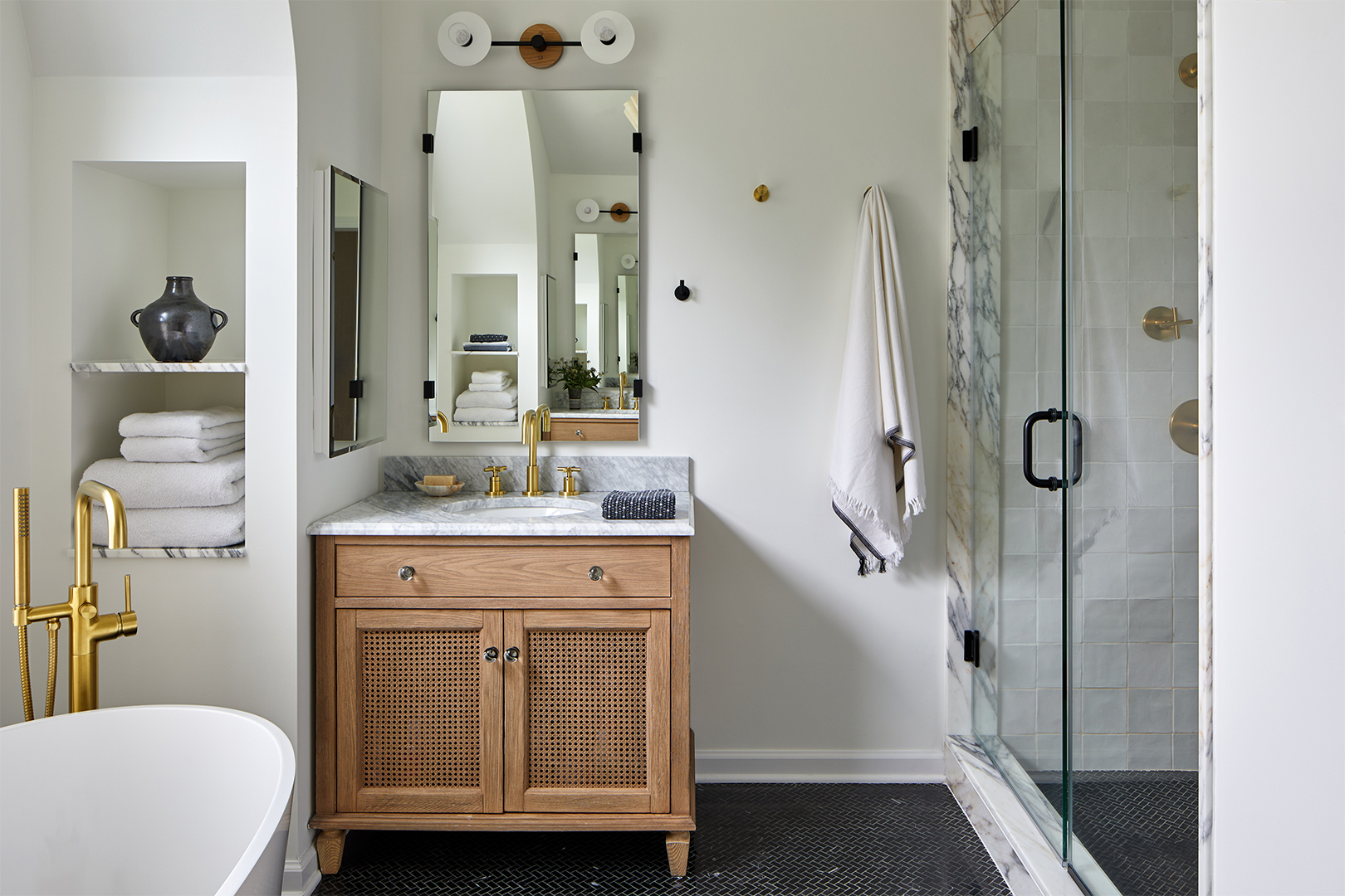 bright white bathroom with black tile floor