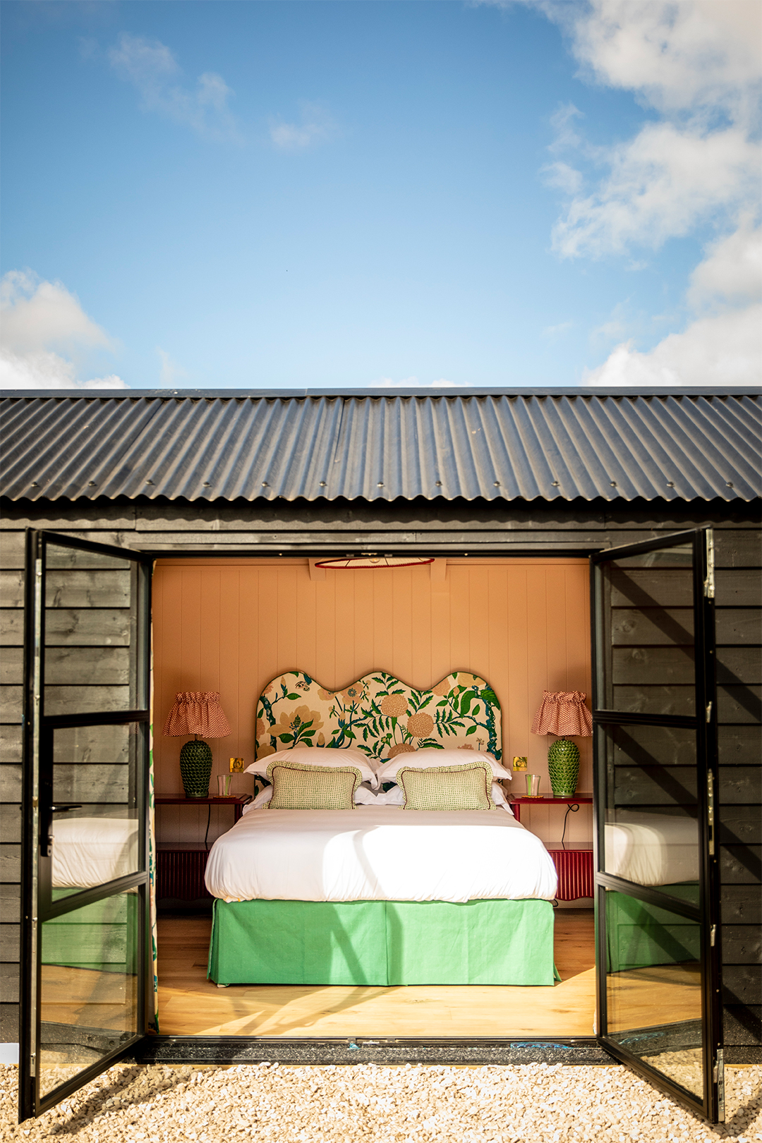 hut with doors open to the bedroom