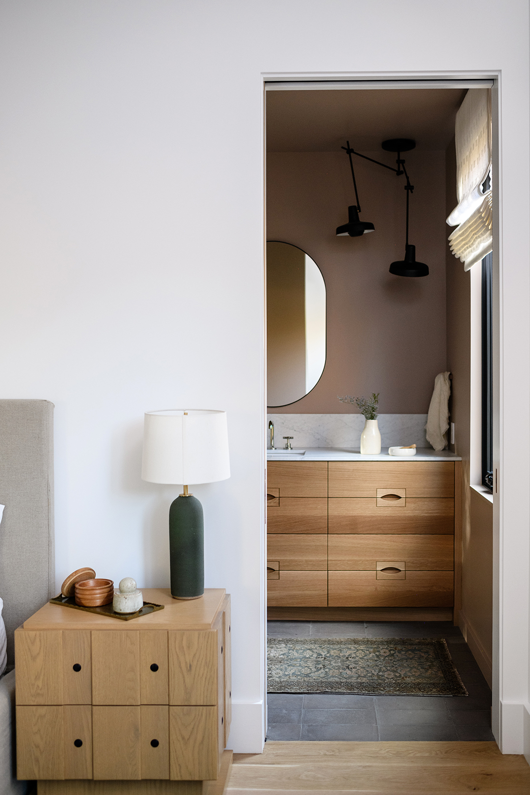 small wood vanity with oval pulls