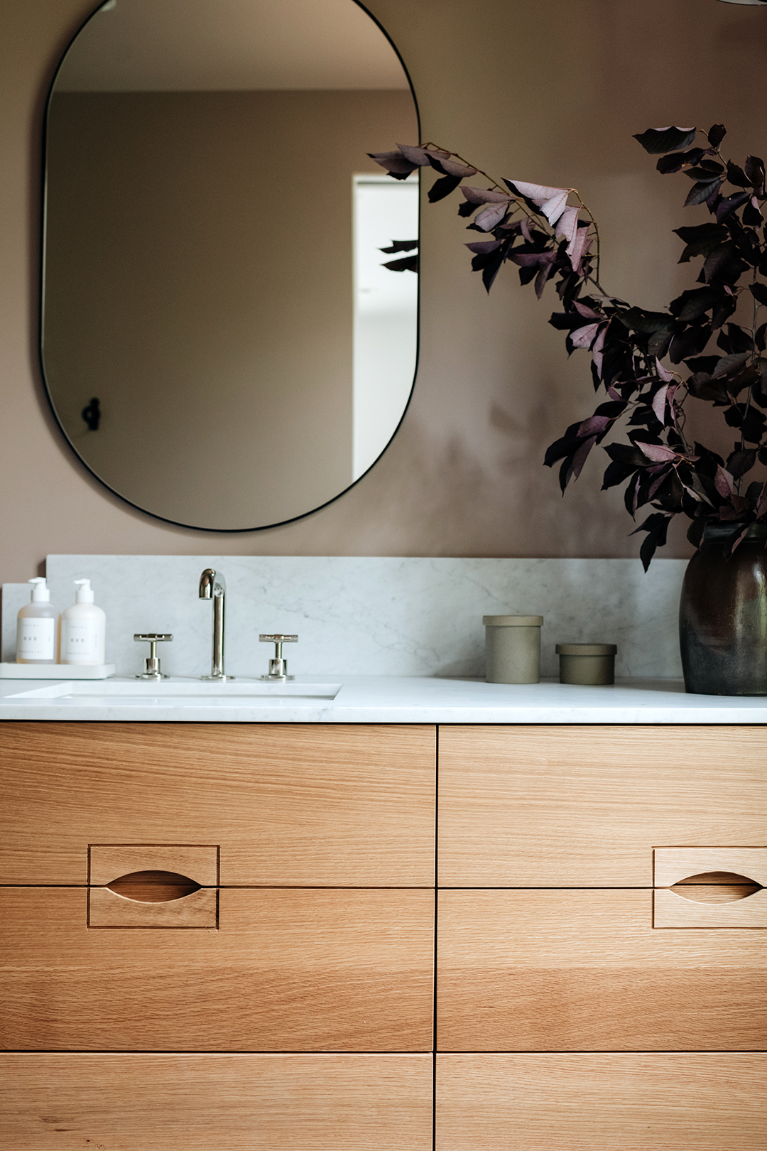 close up of wood vanity integrated hardware