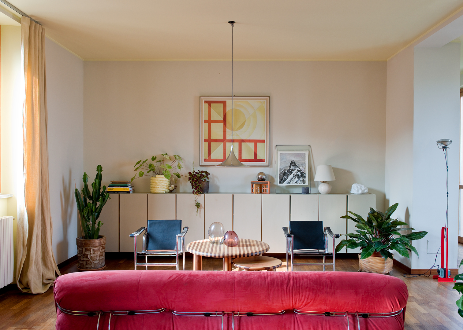 living room with raspberry velvet sofa