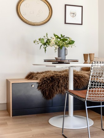 blue cabinet underneath wood bench