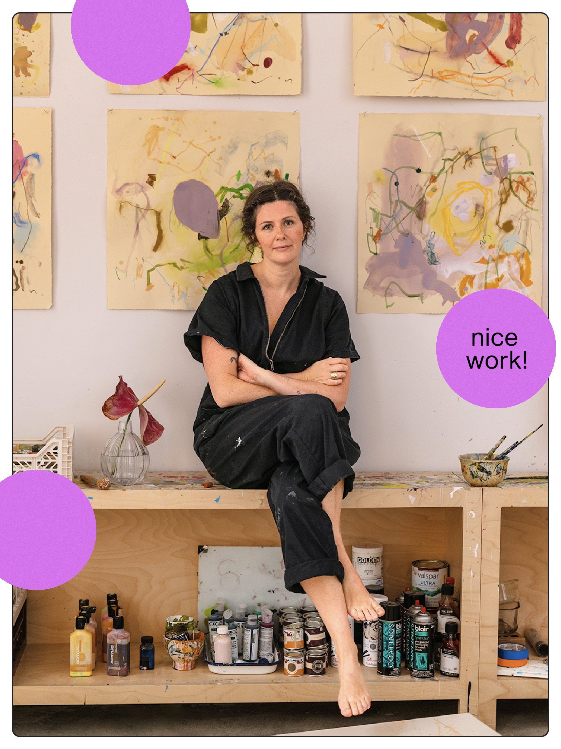 artist sitting on wood shelf with her paintings