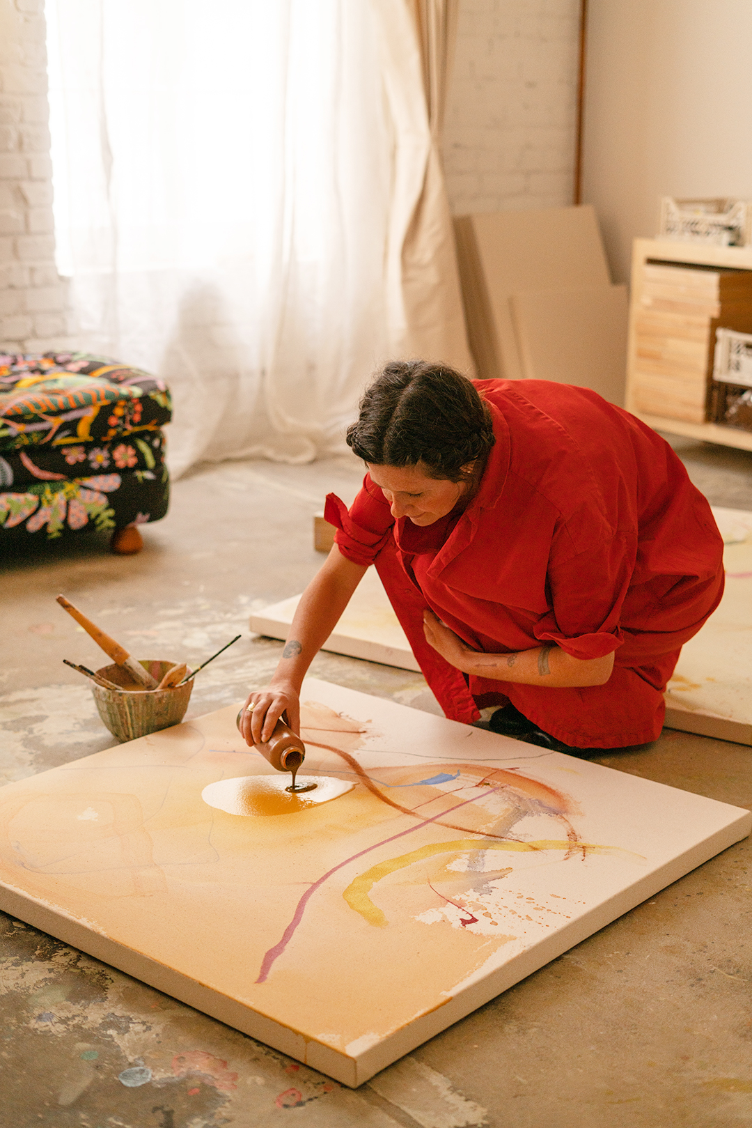 artist painting on the floor