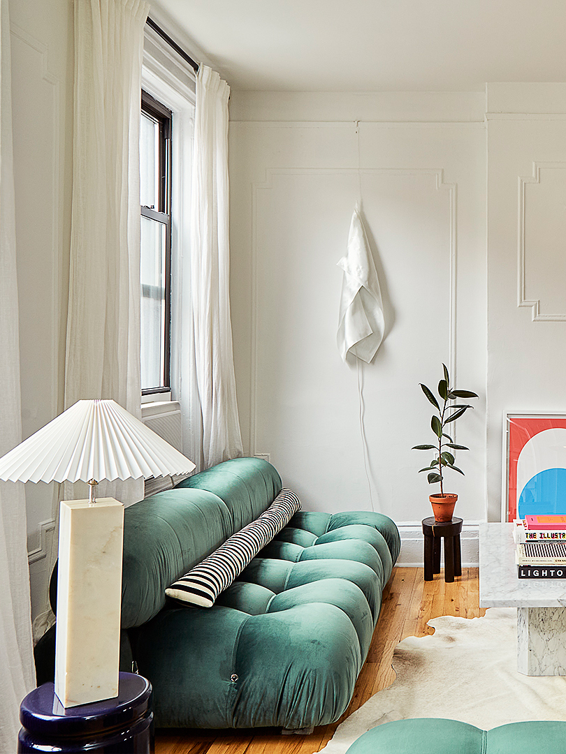 White living room with green Bellini sofa