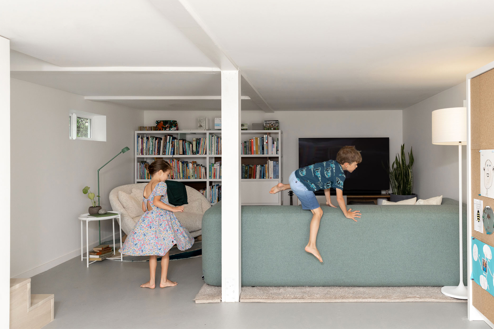 kid climbing over sofa