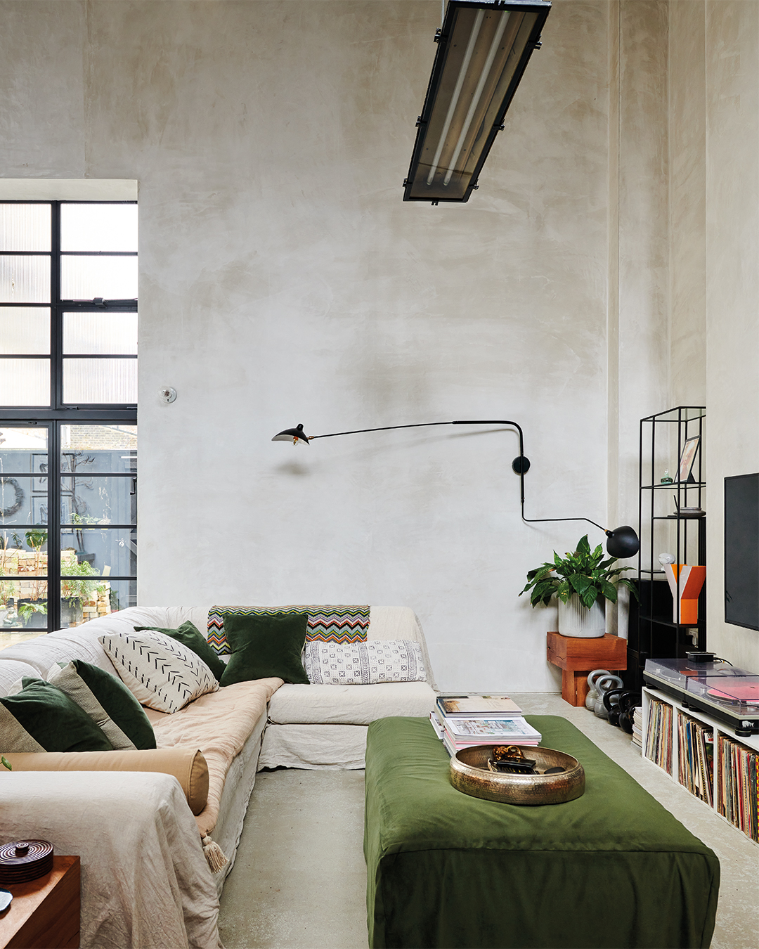 gray plastered living room with large window