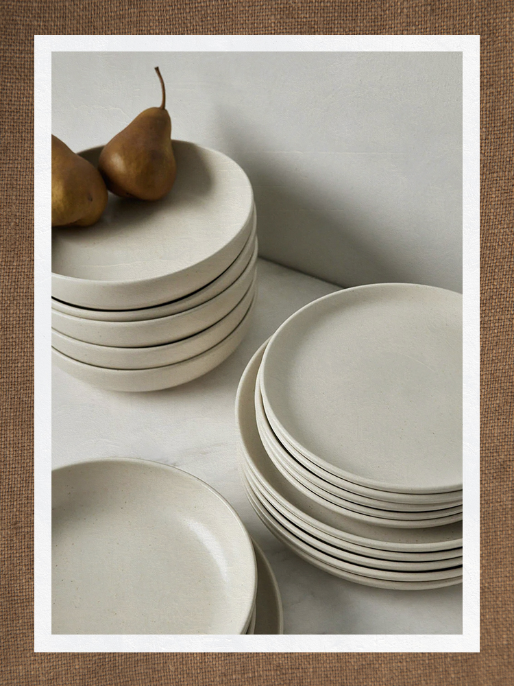 Stacks of neutral cream dinner plates