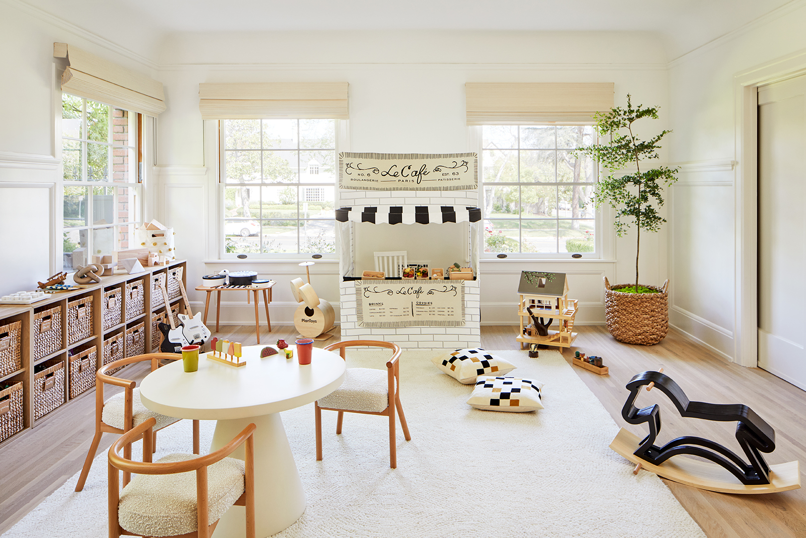 white, airy kids' playroom with bin storage