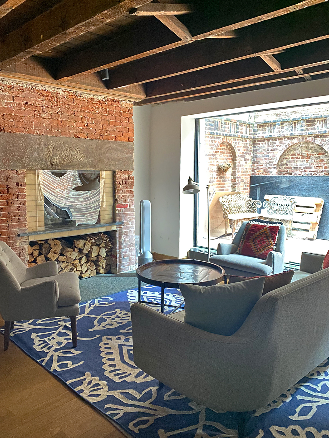 gray sofa and blue rug