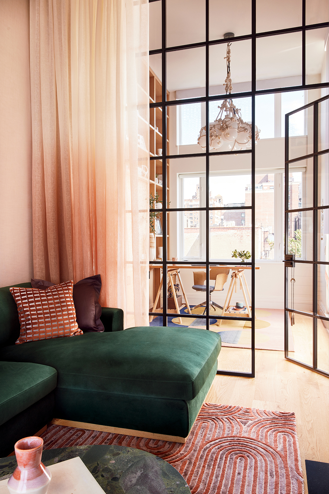 green sofa in pink room