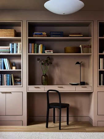 Taupe-painted bespoke shelving