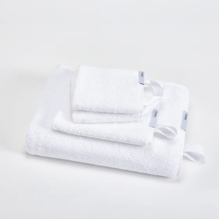  White set of towels folded up, a full set from Havly