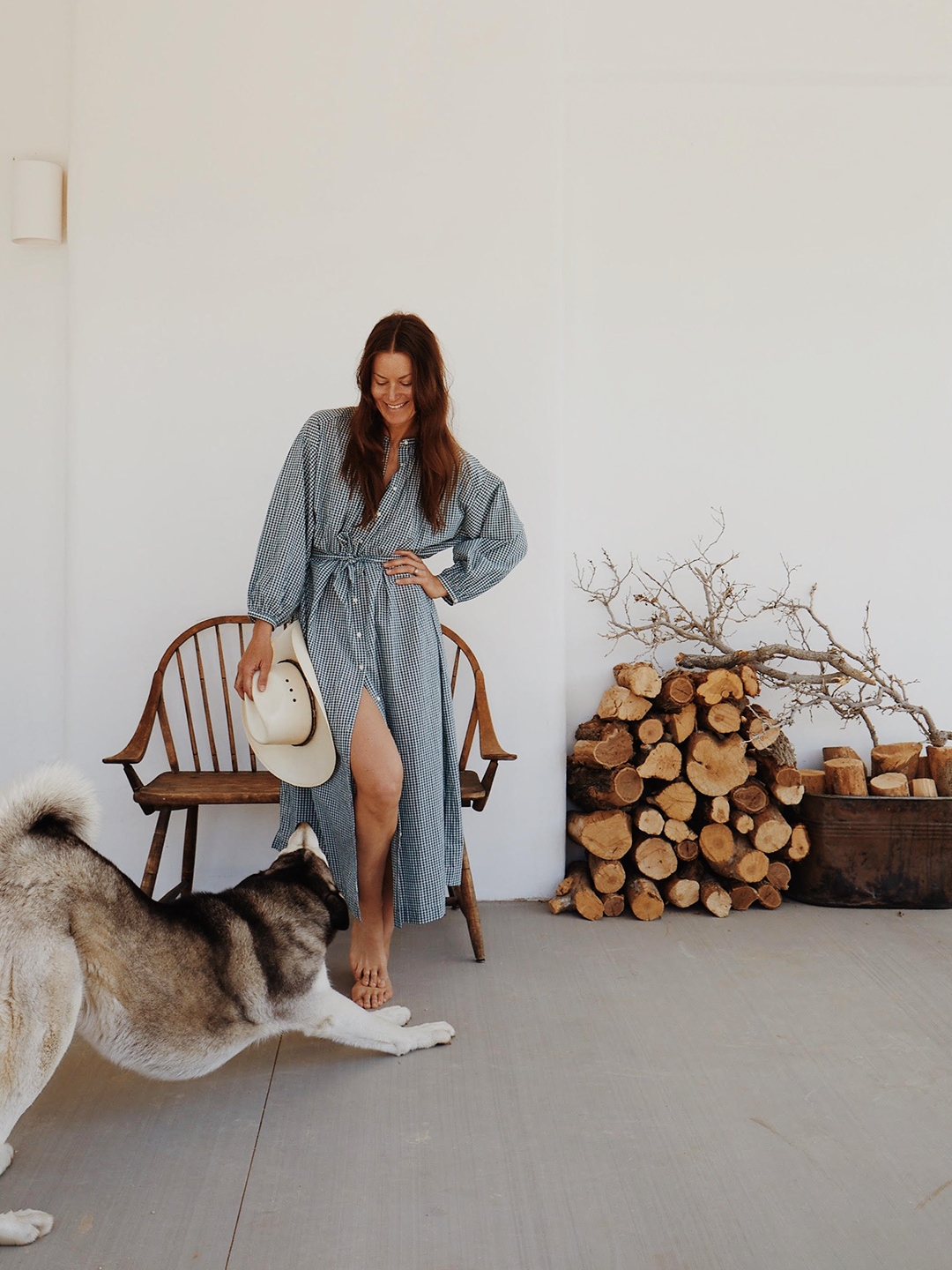 Photographer in dress with her dog