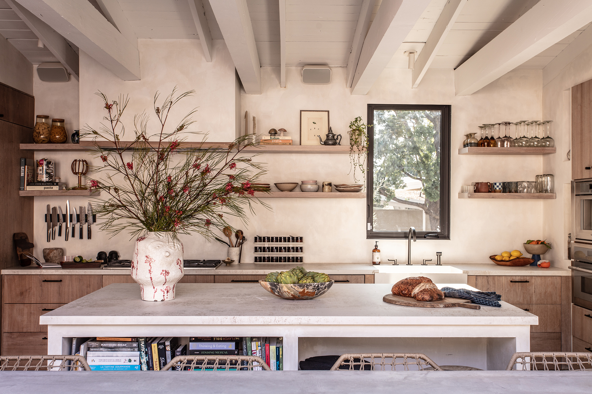 Kitchen with white island and open shelving