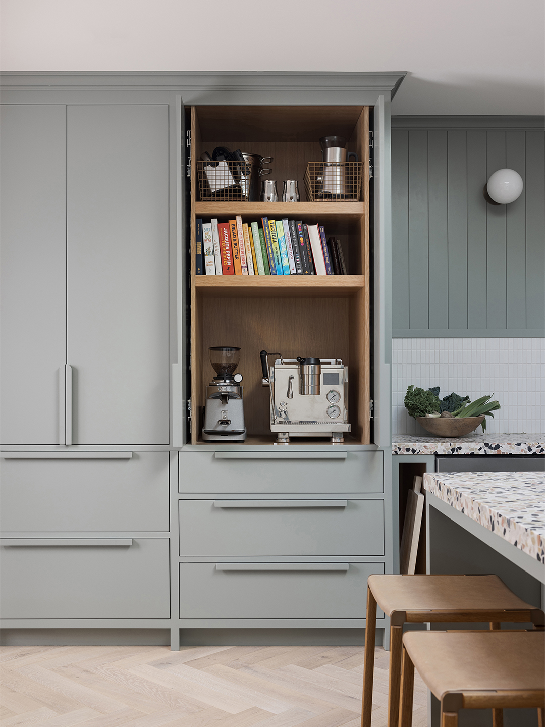 open cabinet doors with coffee machine