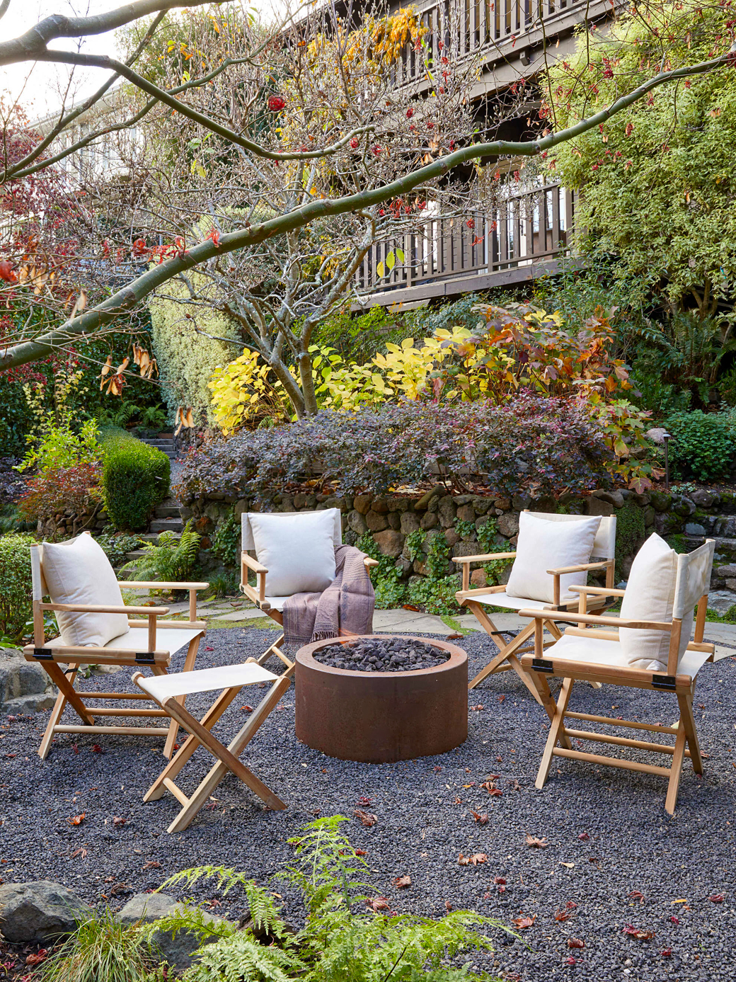 camping chairs around fire pit