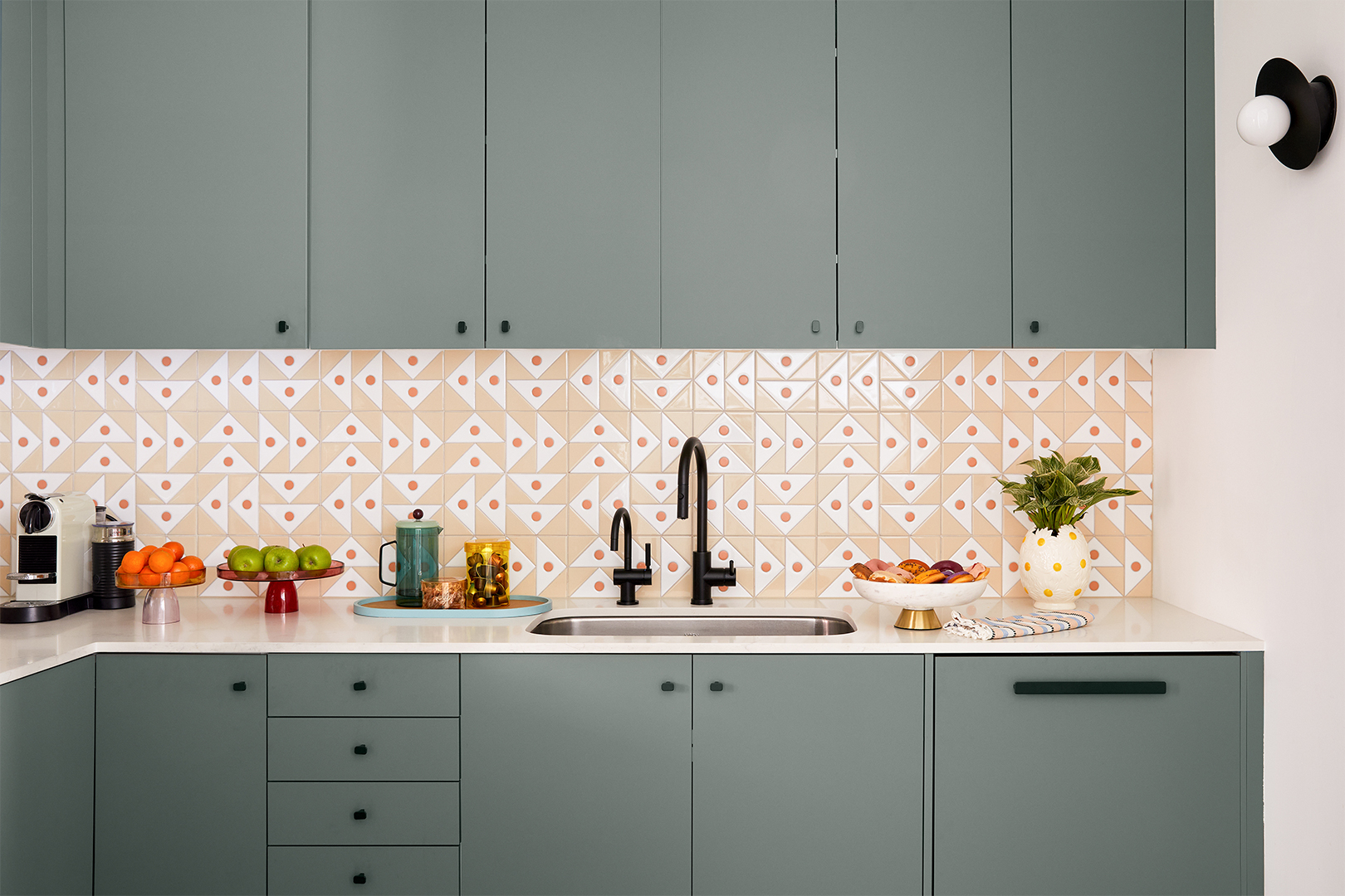 Kitchen with colorful tiles and gray cabinets