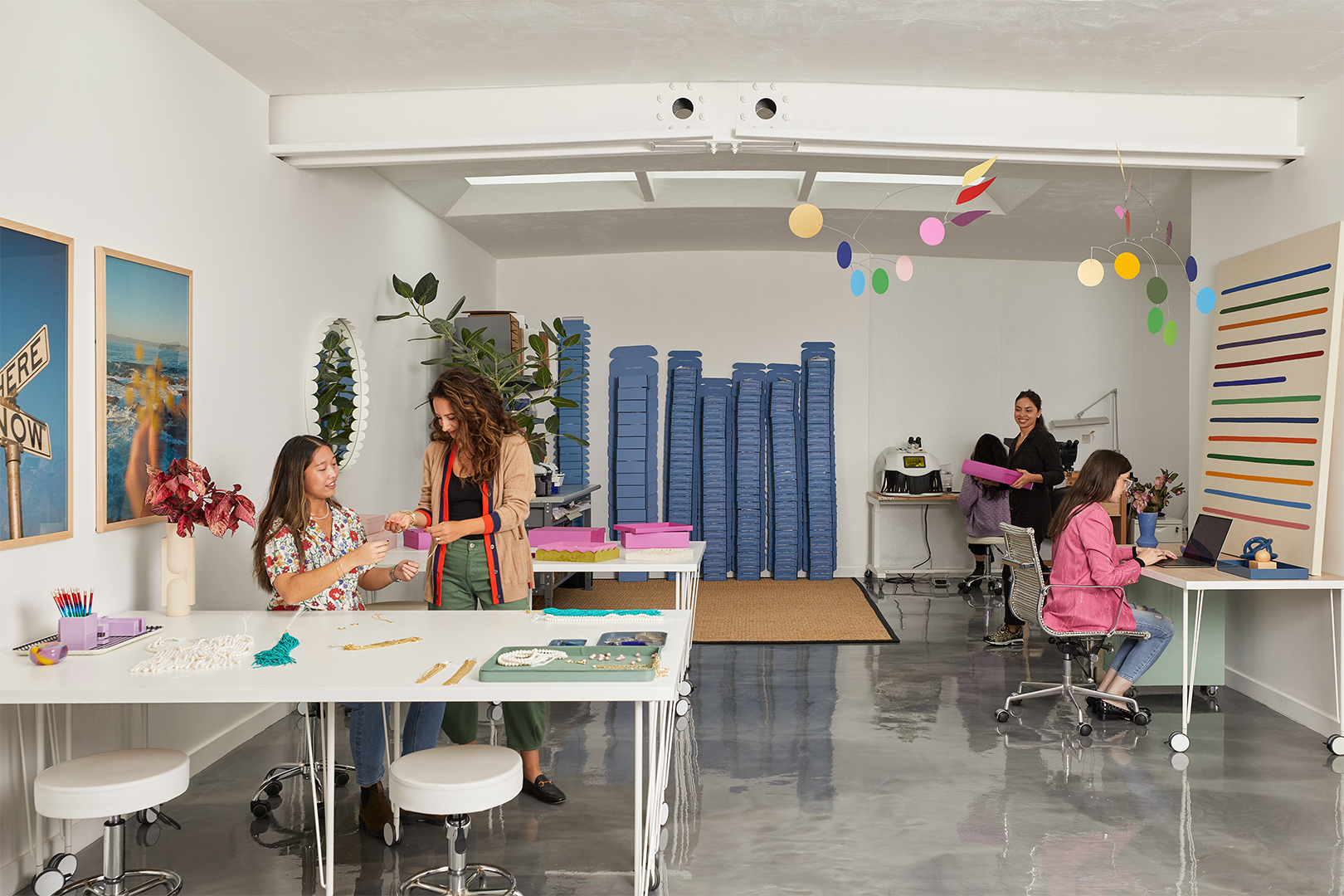 Workspace with colorful mobiles above