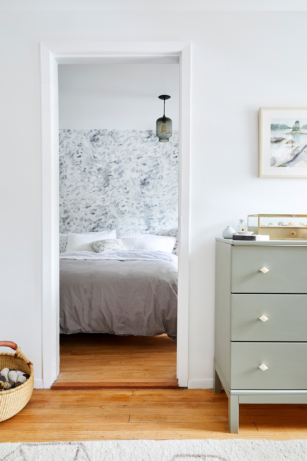 doorway looking into serene bedroom