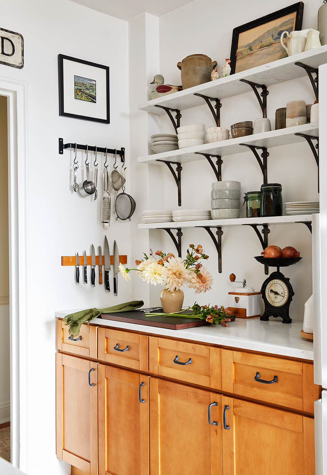 3 rows of open shelves above counter