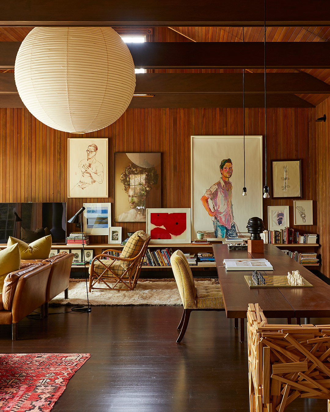 Living room with wood paneled walls