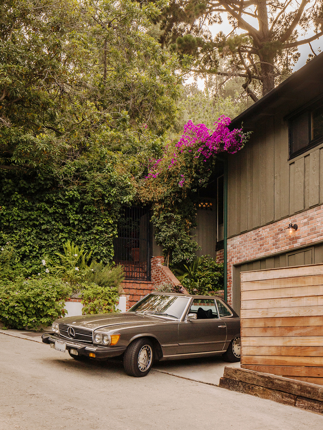 green house with car in driveway