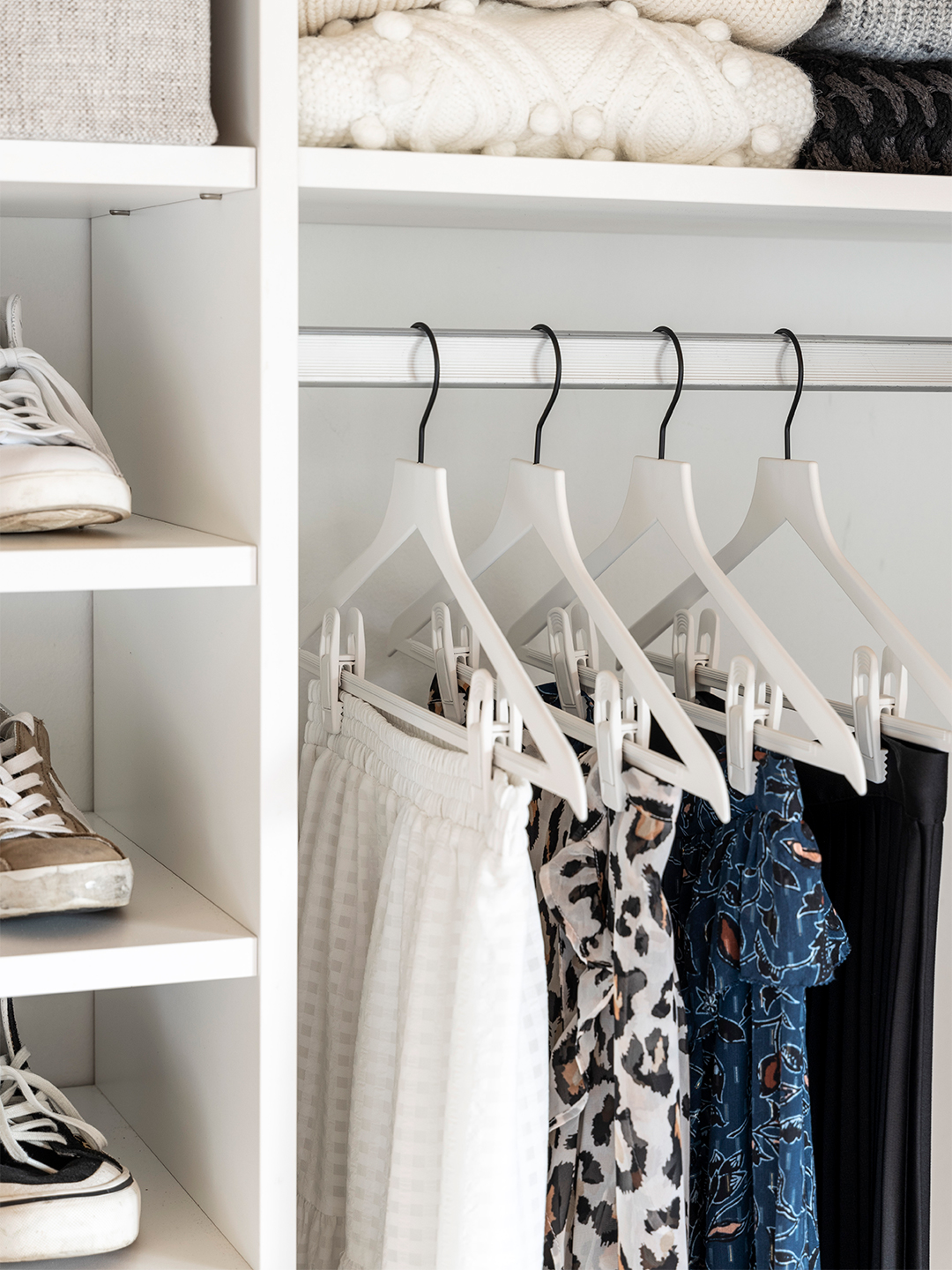 Closet with white hangers