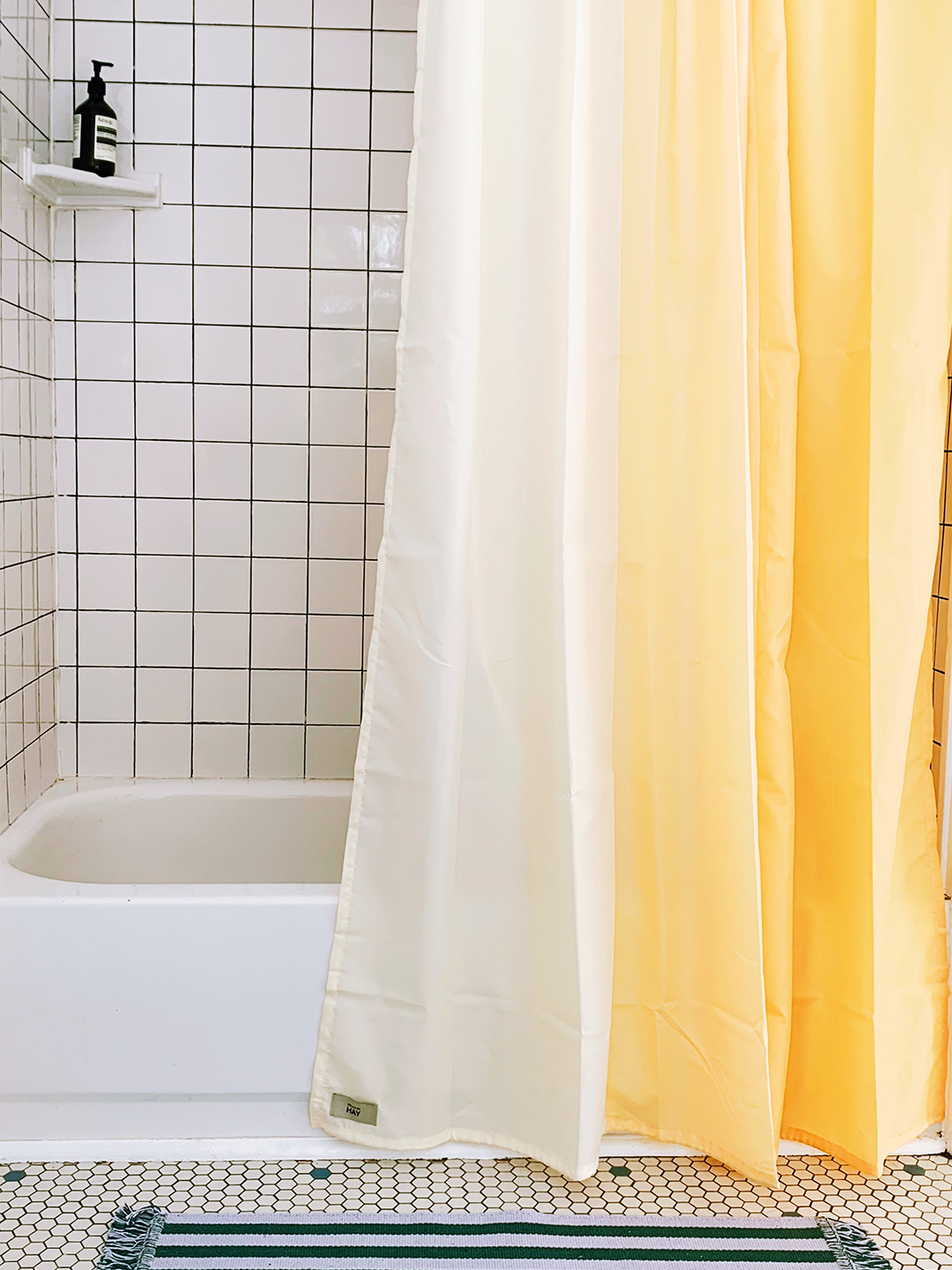 white tiled shower tub