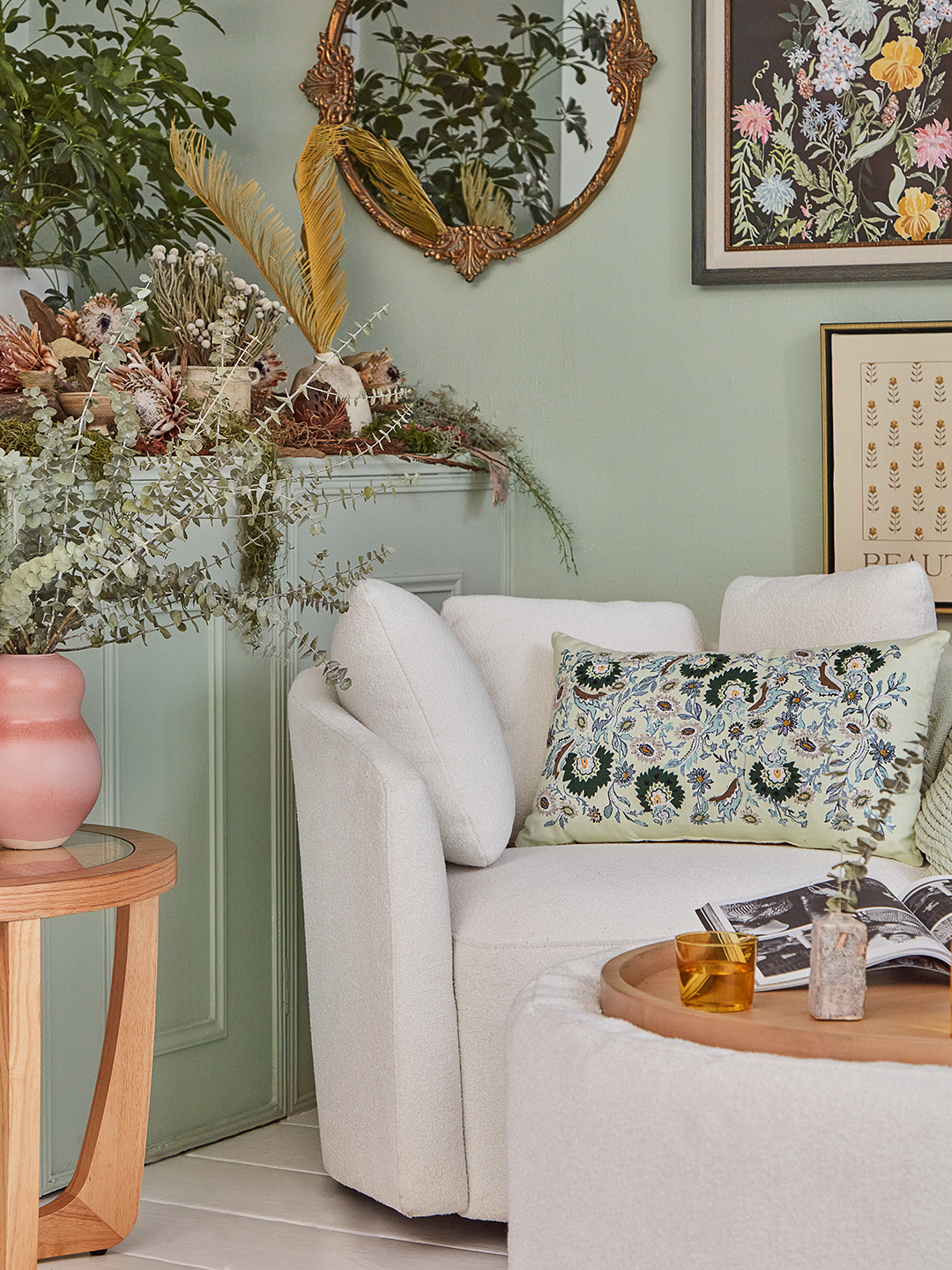 Boucle chair against a sage green background