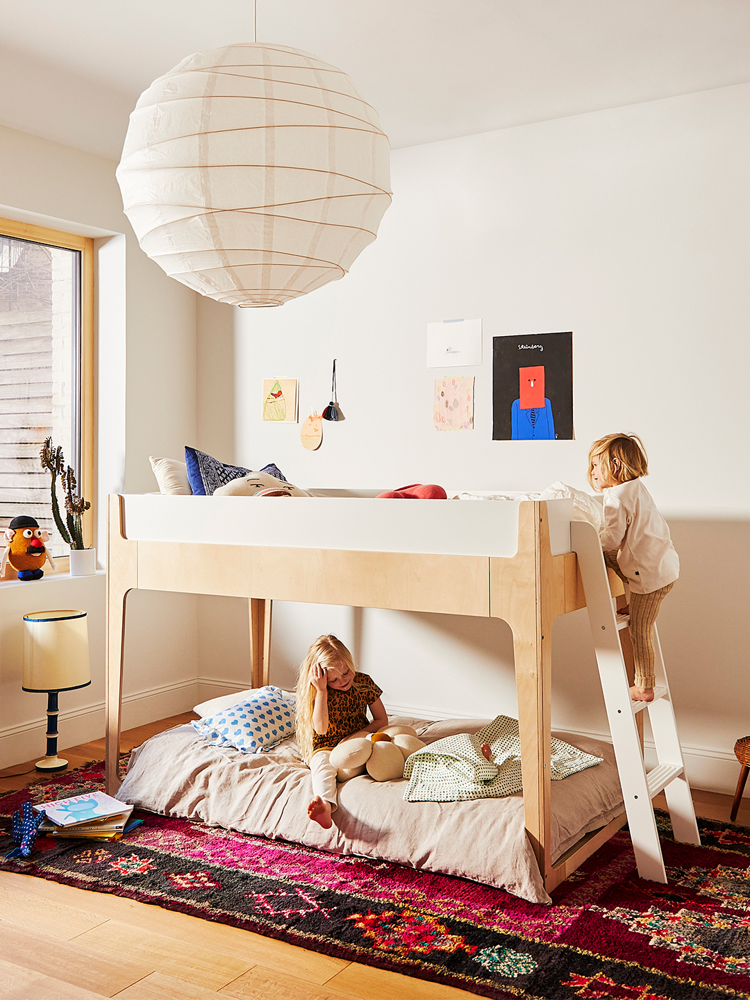 Perch Nest bed in bedroom shown as bunk beds with paper lantern light