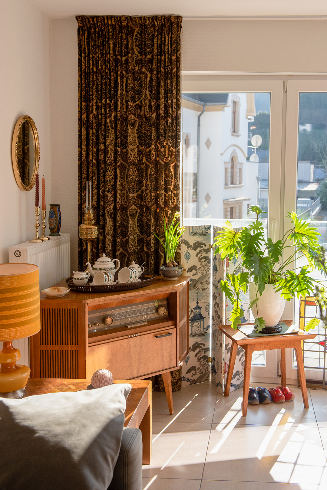 radio cabinet next to curtain