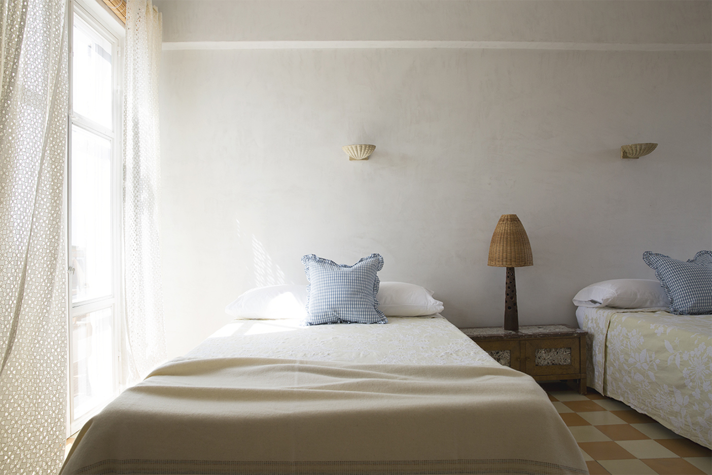 simple guest room with plaster walls