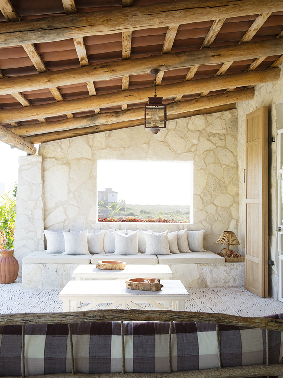 outdoor lounge area with window to ocean