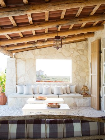 outdoor lounge area with window to ocean