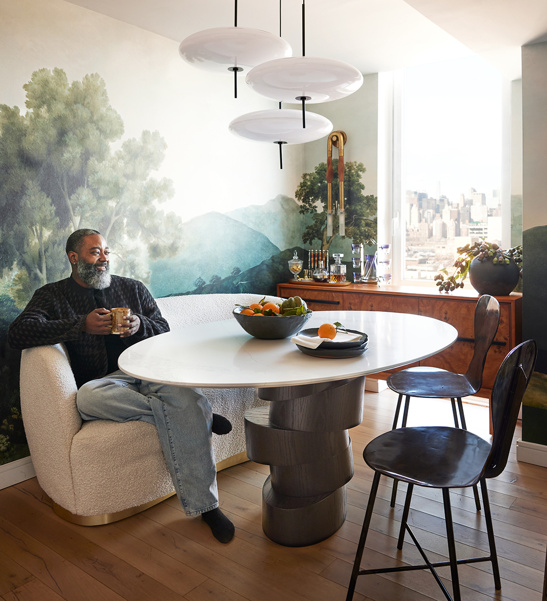 man on dining room banquette