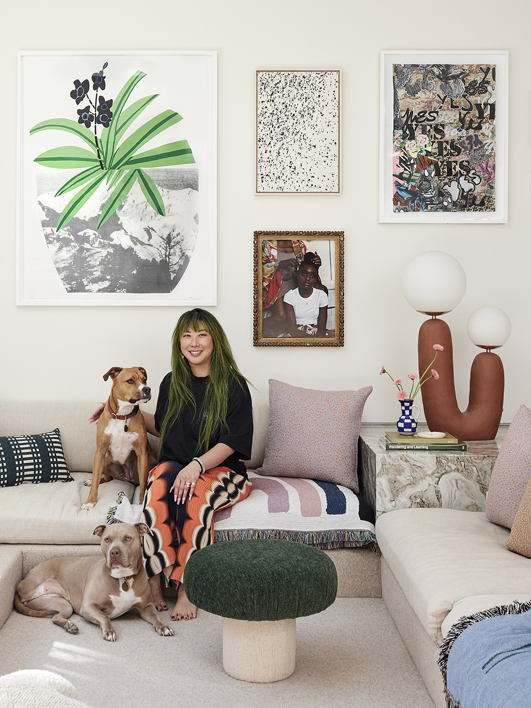 Woman sitting with dog in sunken living room