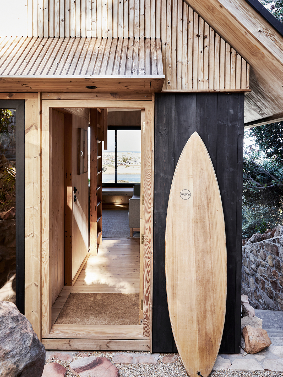 surfboard outside of house