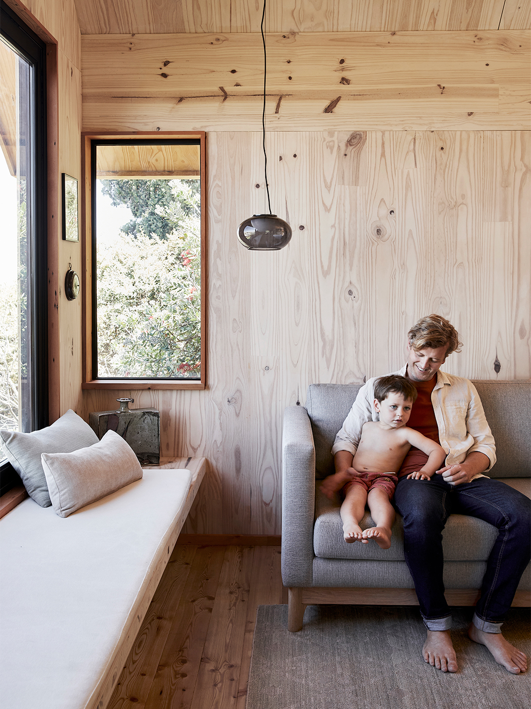 man and son on sofa