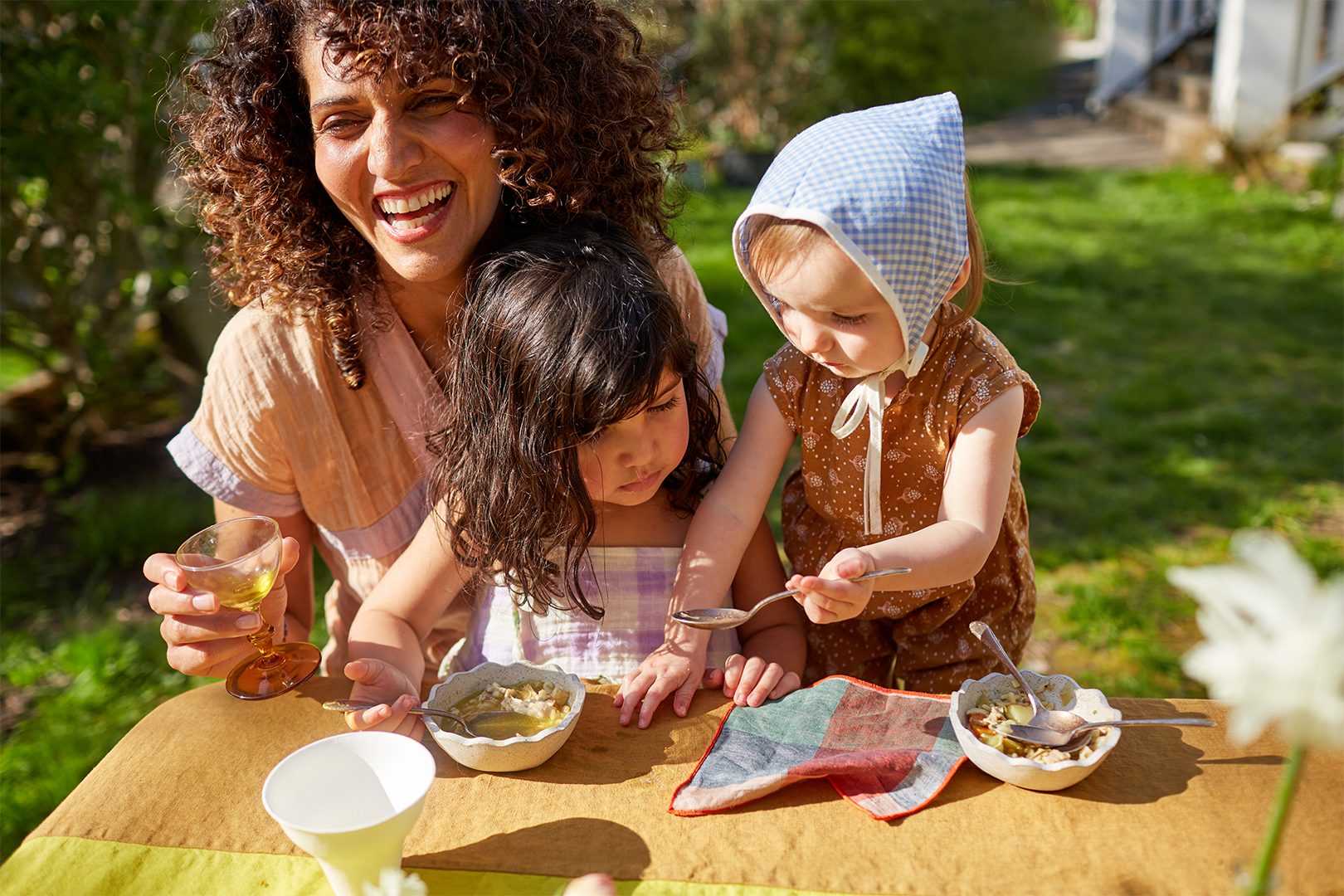 Woman and children at the kids table