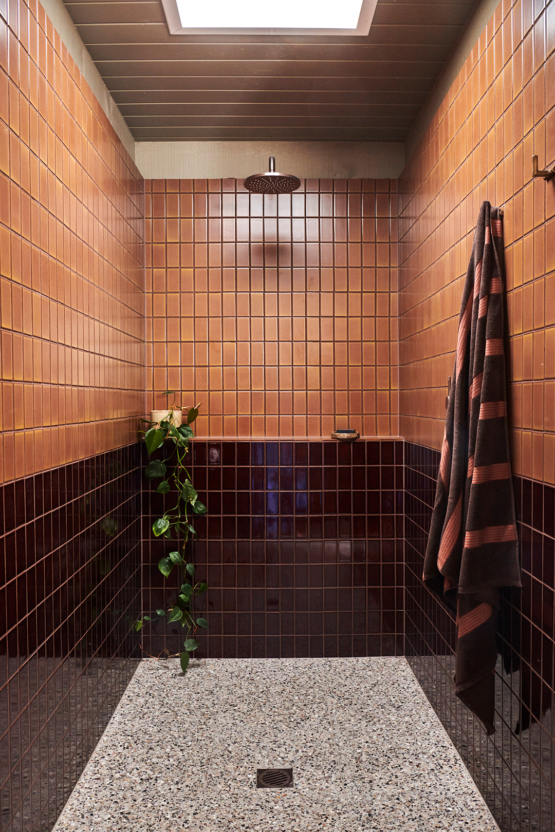 pink and burgundy tiled shower