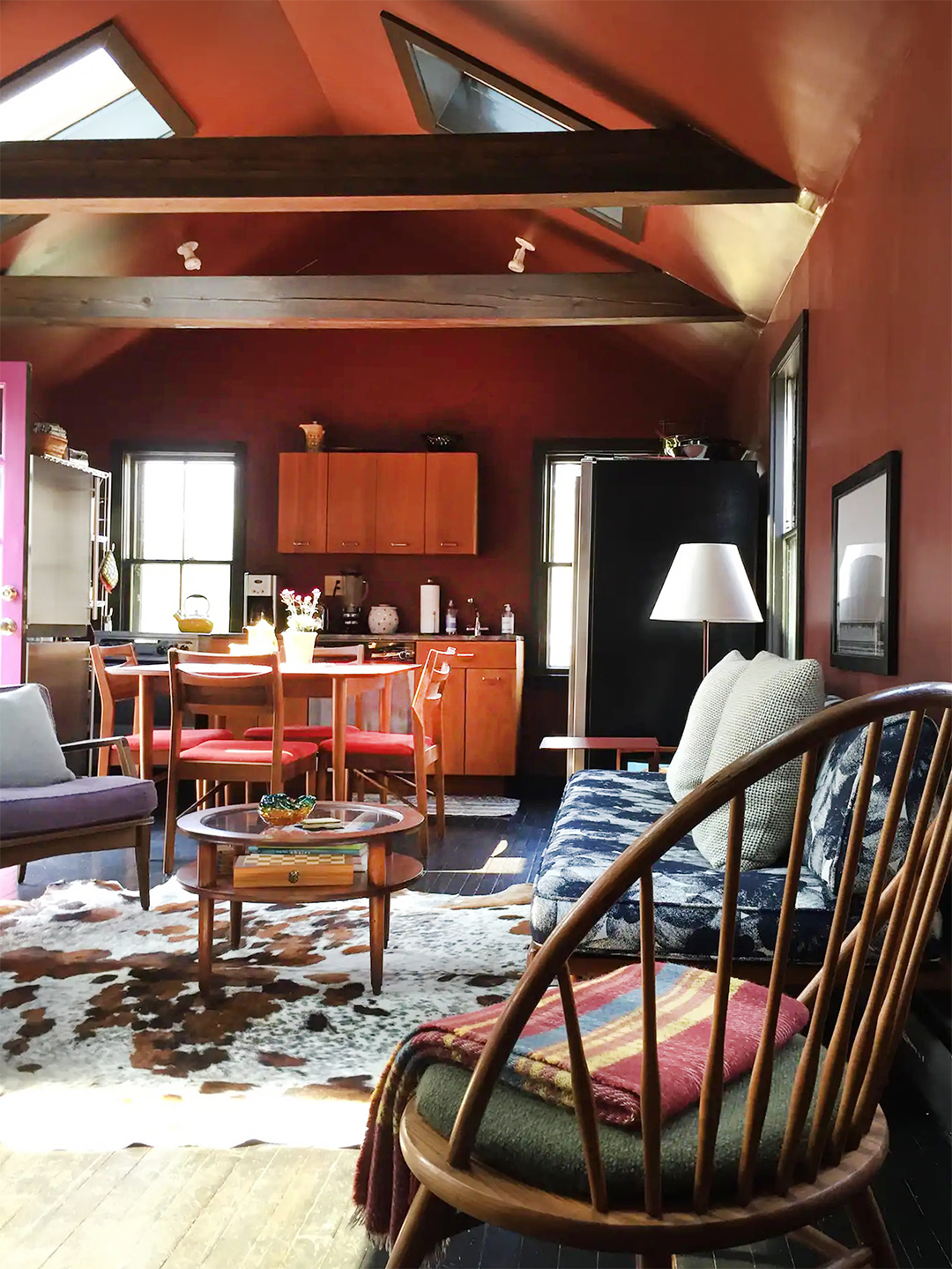 Cozy living room with dark red walls