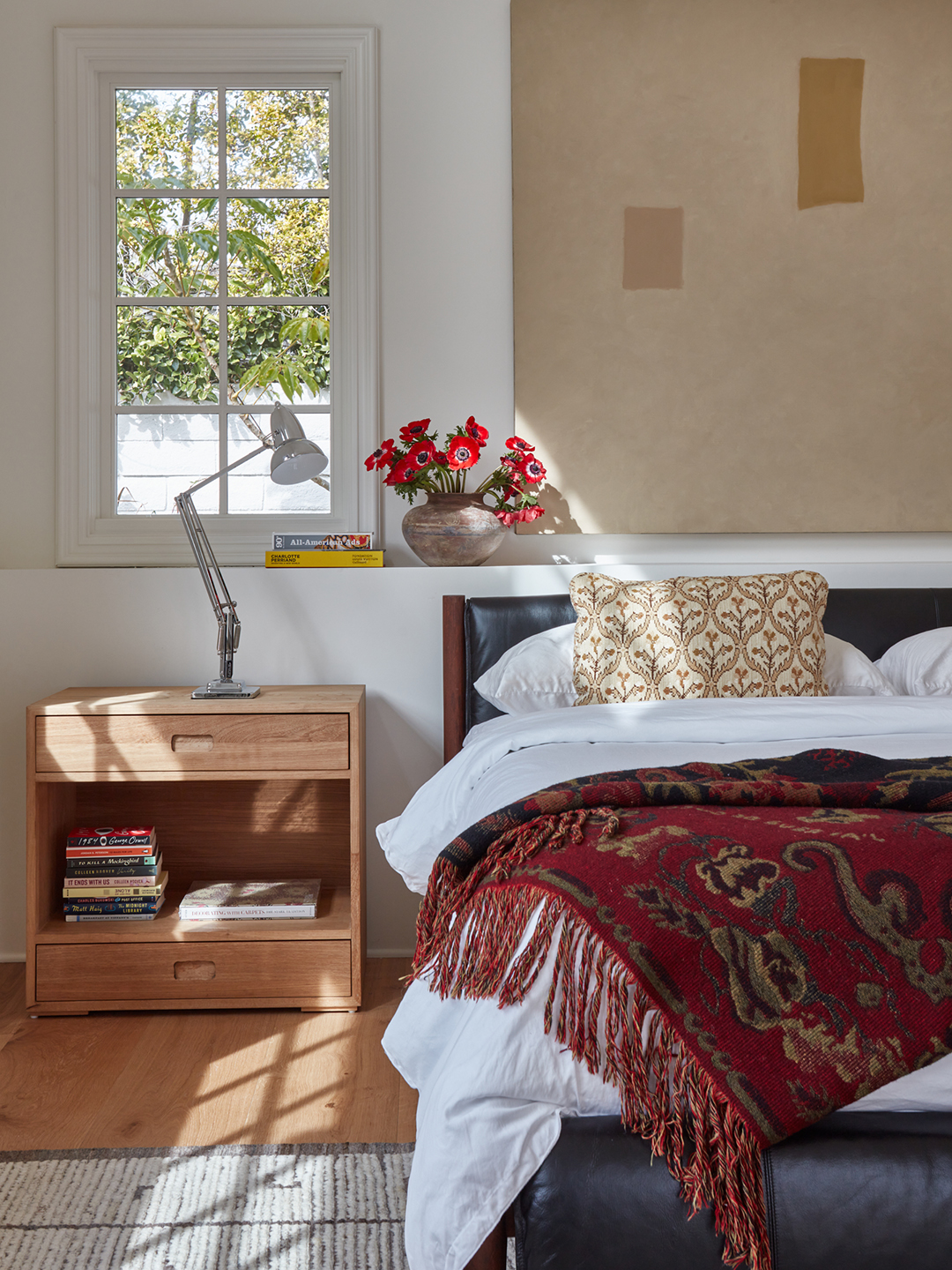 bed with red blanket