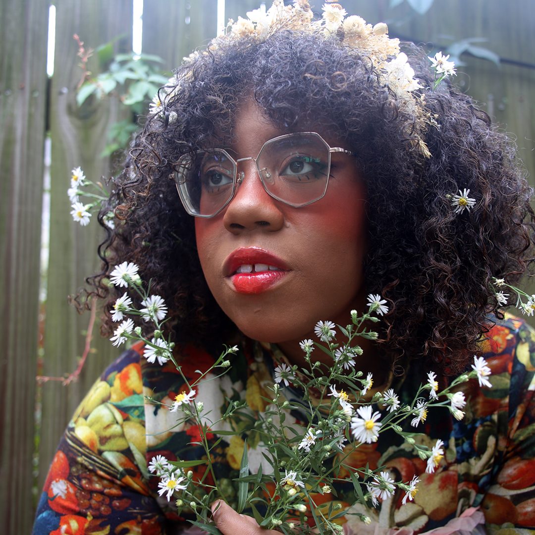 Close up of woman's face and flowers