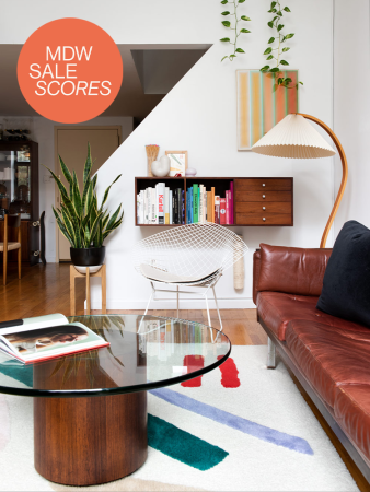 shot of williamsburg living room with sculptural floor lamp and leather sofa