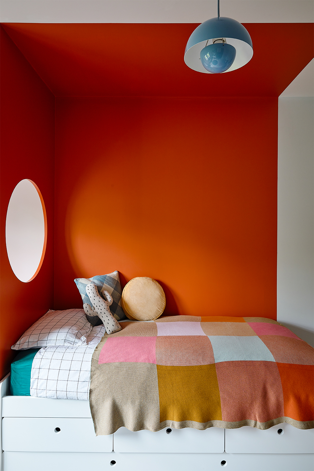 orange bed nook with circle cutout