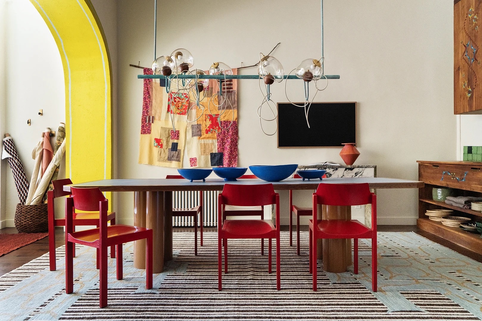 Dining table with chandelier over it