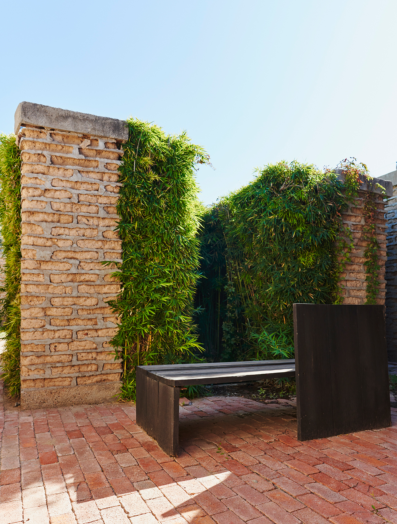 modern wood bench in courtyard